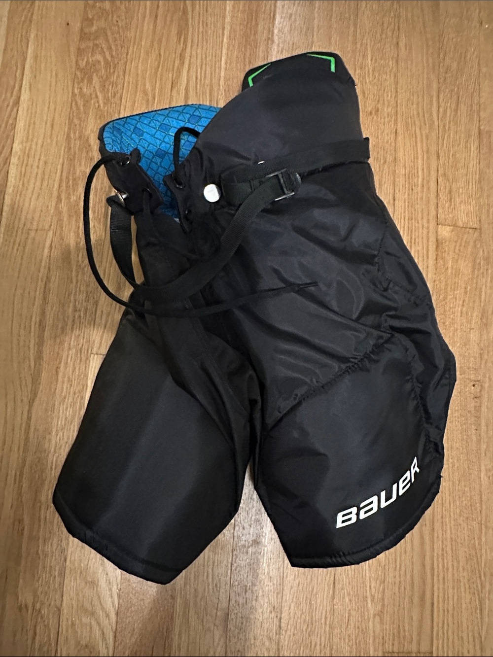 Youth Bauer Black Hockey Pants with Blue Liner and Green Trim